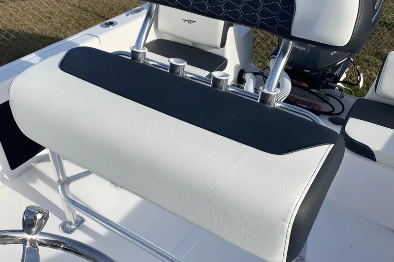 Slide: The Image of 2024 Tidewater 180 CC Adventure boat interior with cushioned seating and steering wheel. - 9