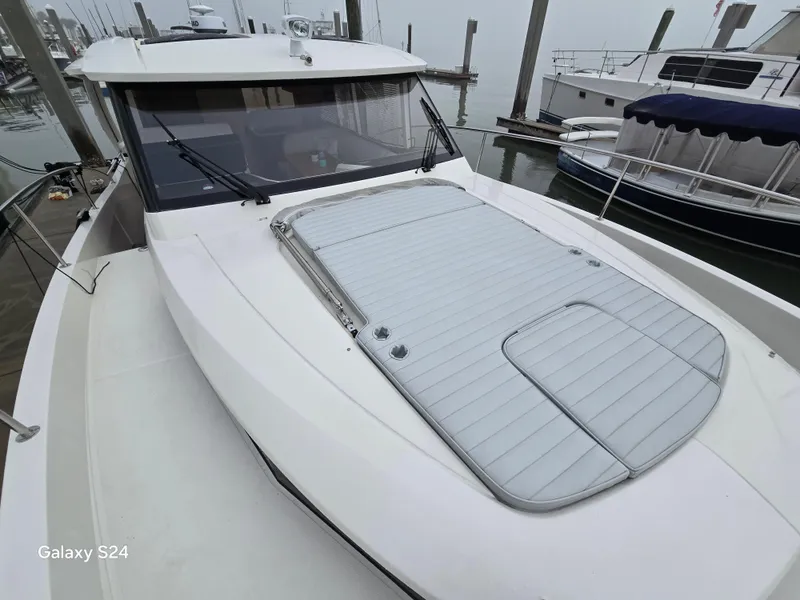Slide: The Image of 2022 Greenline 39 Hybrid yacht docked, showcasing sleek design and modern features. - 31