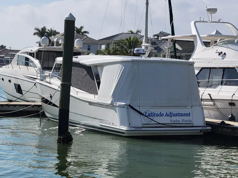 Slide: The Image of 2022 Greenline 39 Hybrid yacht docked in Naples, Florida marina. - 38