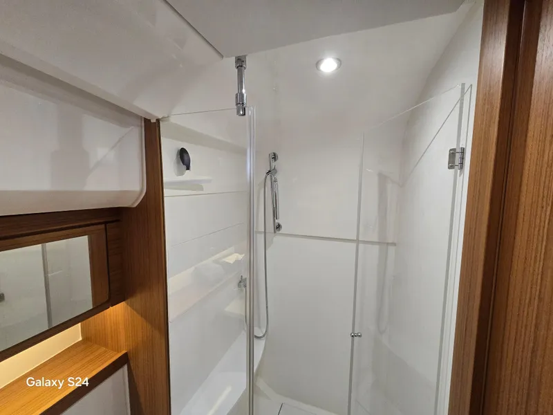 Slide: The Image of Modern bathroom interior in 2022 Greenline 39 Hybrid yacht, featuring glass shower enclosure. - 9