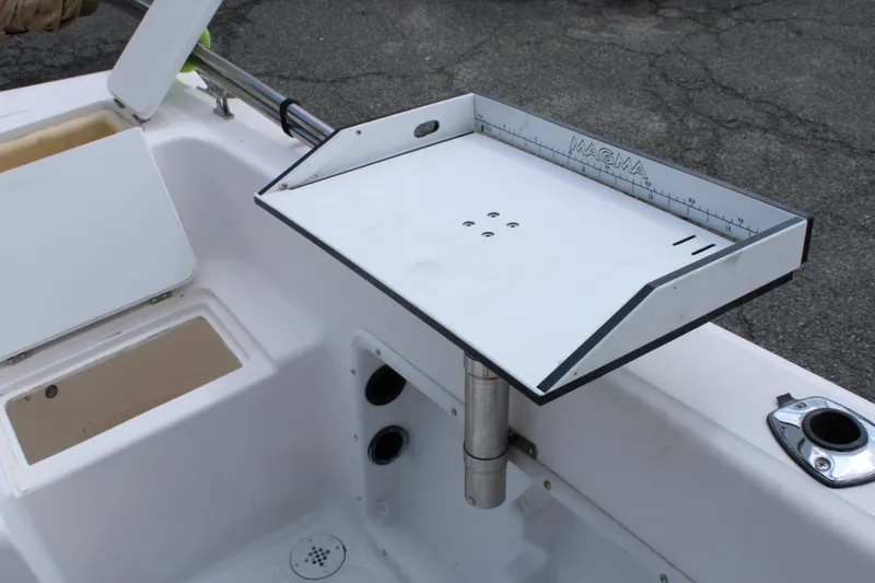 Slide: The Image of 2005 Angler 220 WA boat with Magma cutting board on deck. - 11