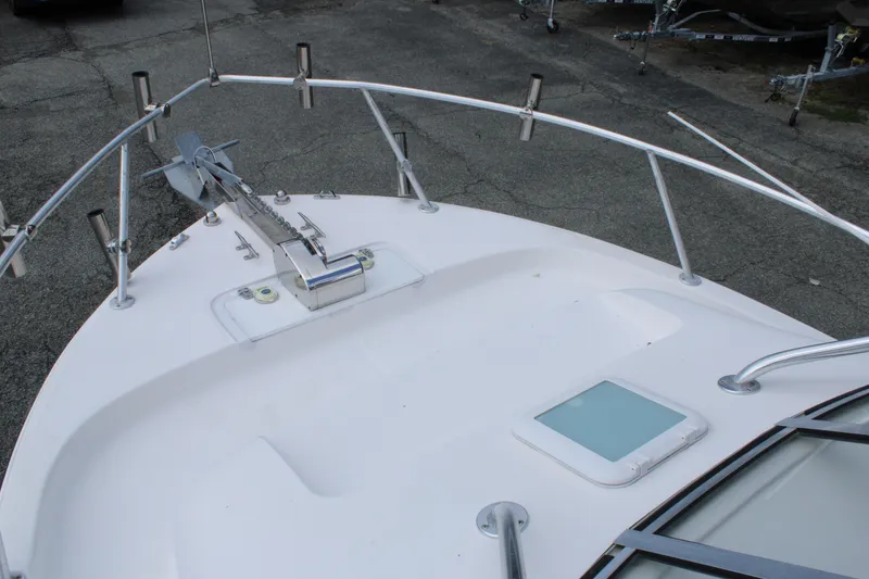 Slide: The Image of Bow view of 2005 Angler 220 WA boat with anchor and rod holders. - 26