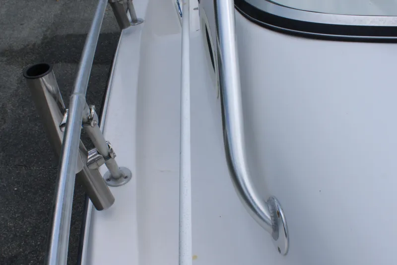 Slide: The Image of 2005 Angler 220 WA boat railing and rod holder detail. - 28