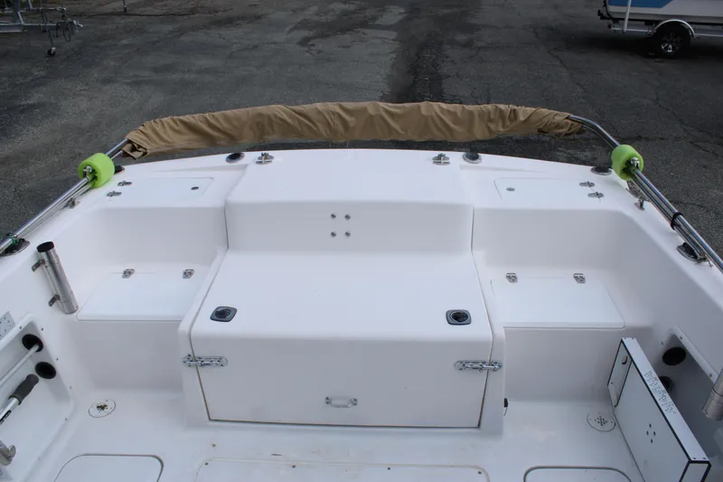 Slide: The Image of 2005 Angler 220 WA boat deck with seating and storage compartments. - 9