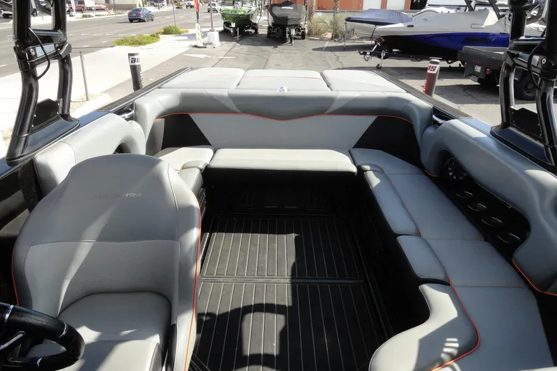 Slide: The Image of 2017 Moomba Craz boat interior with gray seating and black flooring. - 17