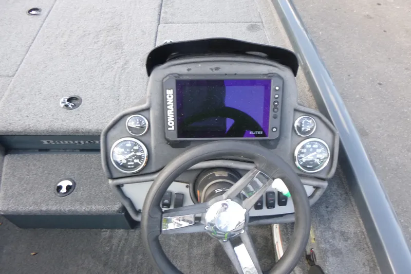 Slide: The Image of 2023 Ranger RT198P boat dashboard with Lowrance Elite display and gauges. - 11