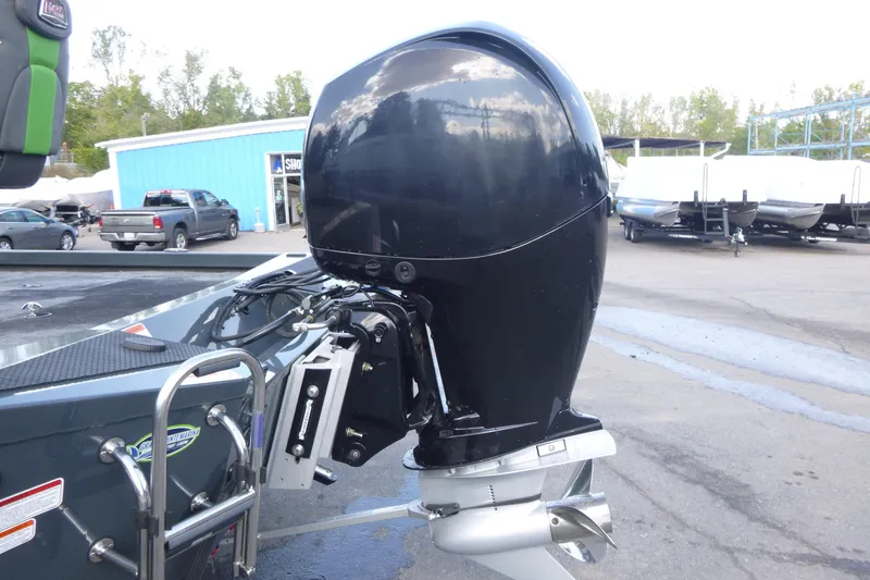 Slide: The Image of 2023 Ranger RT198P boat with a powerful outboard motor in a dealership lot. - 14