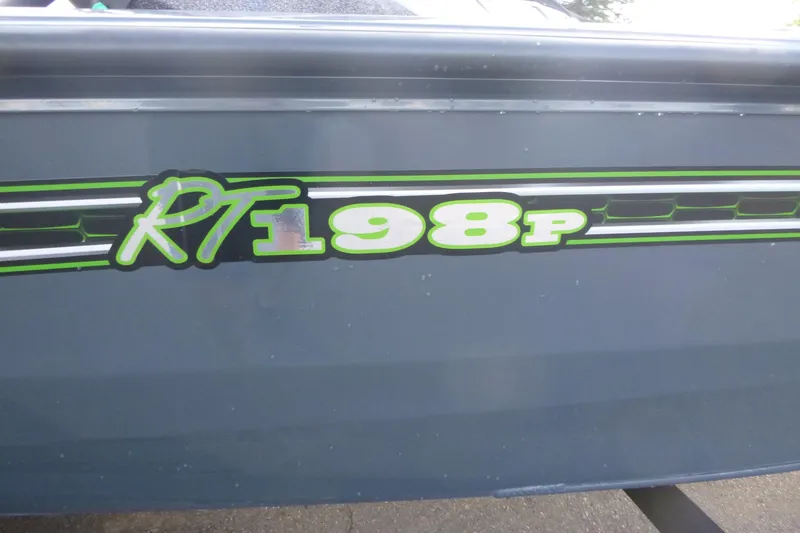 Slide: The Image of 2023 Ranger RT198P boat decal with green and white lettering on a dark surface. - 15