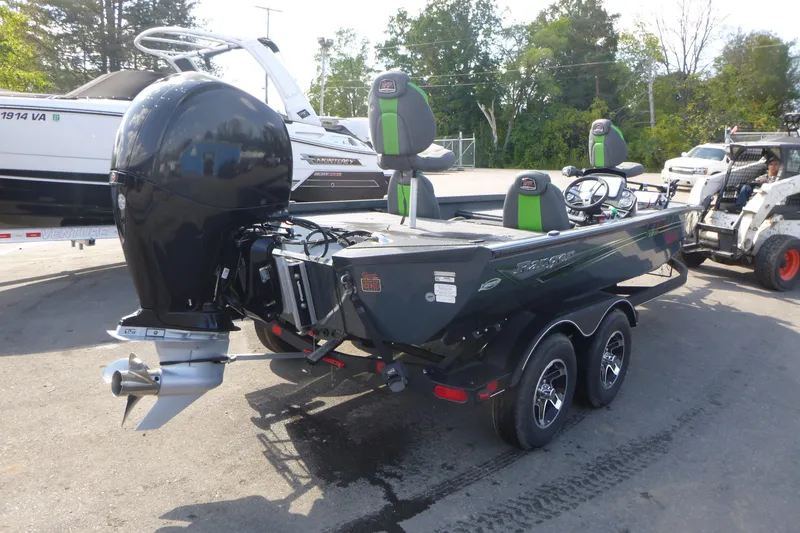 Slide: The Image of 2023 Ranger RT198P boat with powerful outboard motor, parked on a trailer. - 2