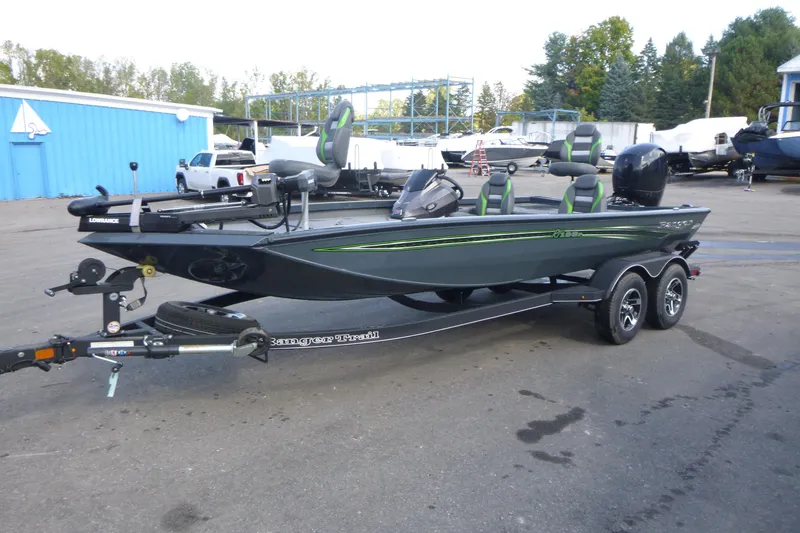 Slide: The Image of 2023 Ranger RT198P fishing boat on trailer, parked outdoors. - 4