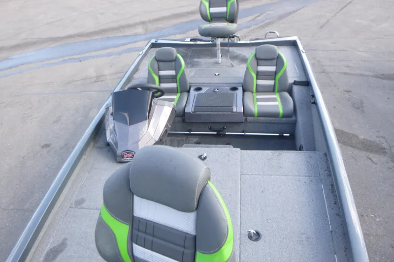 Slide: The Image of 2023 Ranger RT198P boat interior with gray and green seating, steering console, and storage compartments. - 6