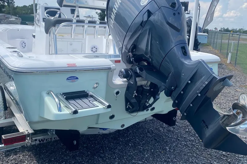 Slide: The Image of 2024 Tidewater 1910 Bay Max boat with Yamaha outboard motor, displayed on a trailer. - 1