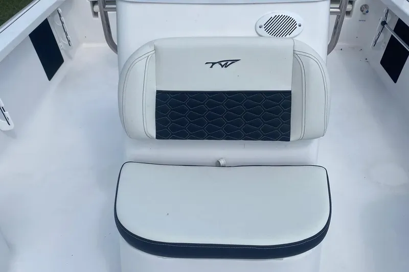 Slide: The Image of 2024 Tidewater 1910 Bay Max boat seat with white and black upholstery. - 4
