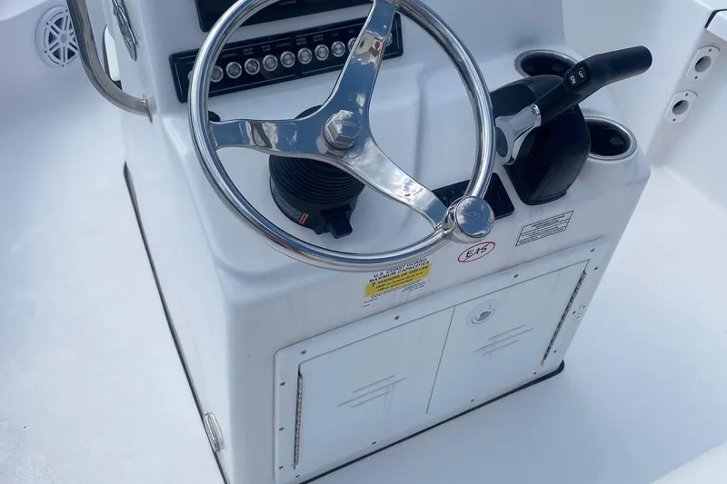 Slide: The Image of 2024 Tidewater 1910 Bay Max boat console with steering wheel and controls. - 5