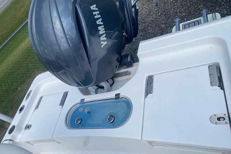 Slide: The Image of 2024 Tidewater 1910 Bay Max boat with Yamaha engine, featuring storage compartments and livewell. - 7