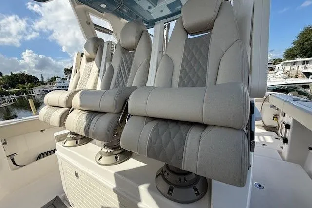 Slide: The Image of Luxury seating on 2026 Solace 37 CS boat, featuring plush, diamond-stitched upholstery. - 5