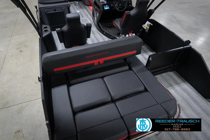 Slide: The Image of 2026 Bennington 24 MSB boat interior with black seating and modern design. - 13