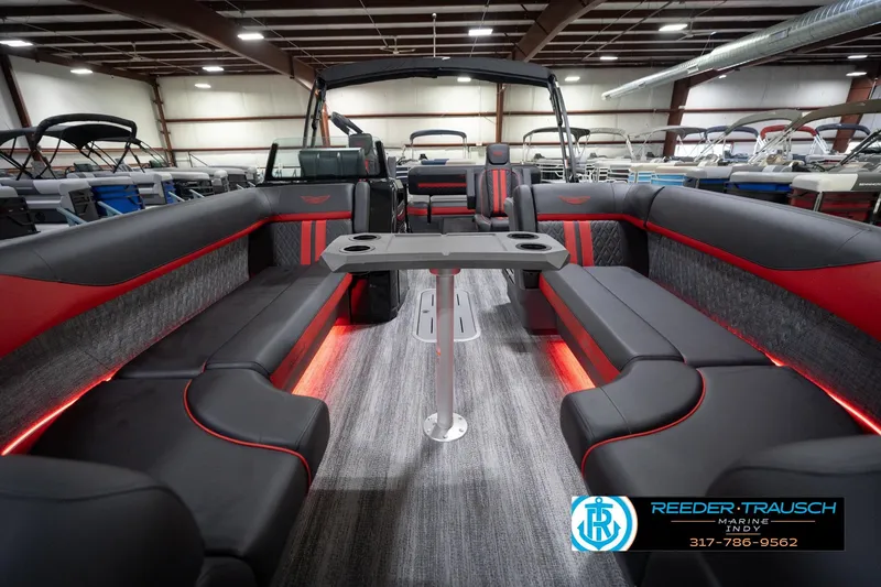 Slide: The Image of 2026 Bennington 24 MSB pontoon boat interior with sleek seating and ambient lighting. - 14