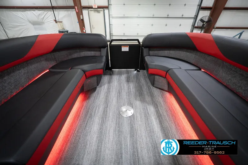 Slide: The Image of Luxurious interior of 2026 Bennington 24 MSB pontoon boat with red LED lighting. - 20