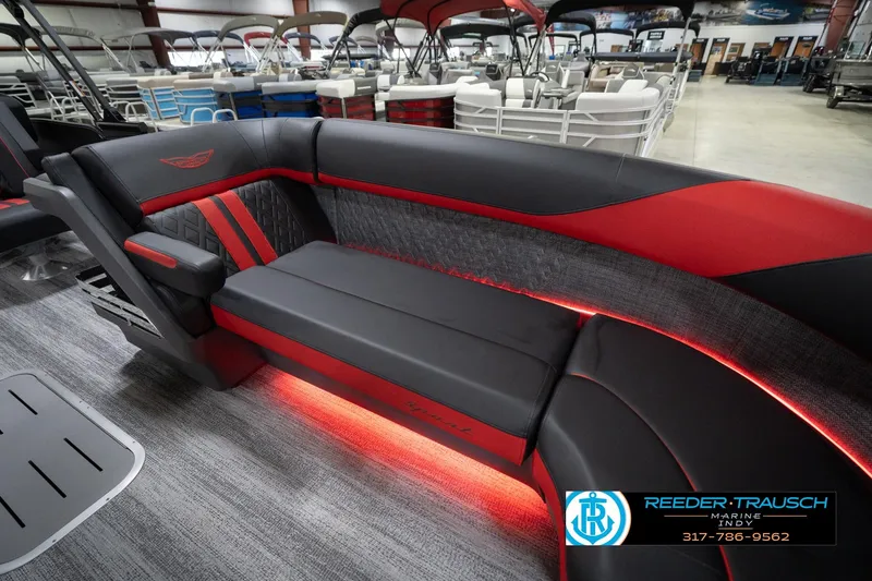 Slide: The Image of Luxurious interior of 2026 Bennington 24 MSB pontoon boat with red LED lighting. - 22