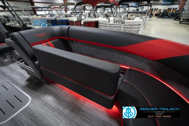Slide: The Image of 2026 Bennington 24 MSB pontoon boat interior with sleek black and red seating. - 23