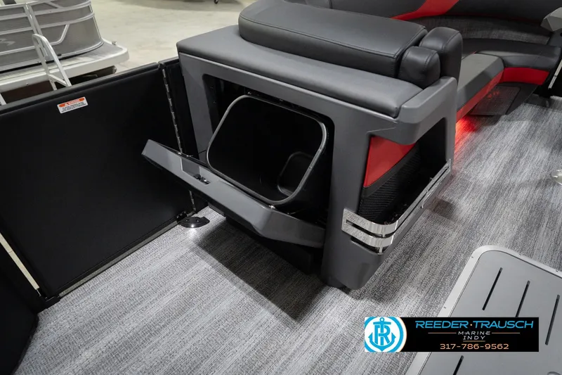 Slide: The Image of 2026 Bennington 24 MSB boat interior with storage compartment and seating. - 26