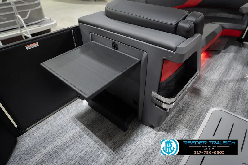 Slide: The Image of 2026 Bennington 24 MSB boat interior with fold-out table and seating. - 27