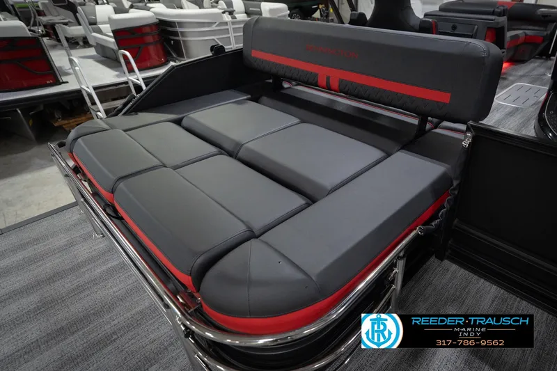 Slide: The Image of 2026 Bennington 24 MSB boat interior with gray and red cushioned seating. - 30
