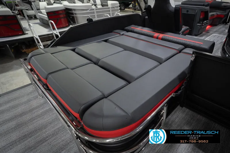 Slide: The Image of 2026 Bennington 24 MSB pontoon boat with luxurious gray and red seating. - 31