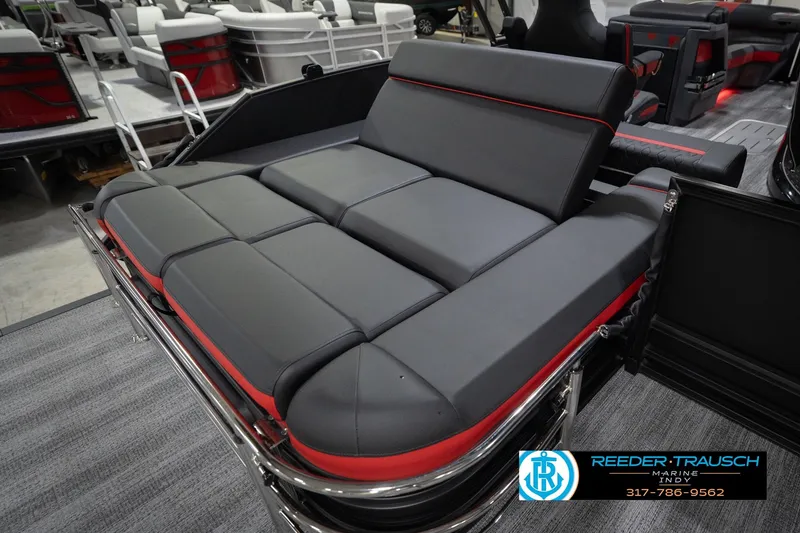 Slide: The Image of 2026 Bennington 24 MSB boat interior with sleek gray and red seating. - 32