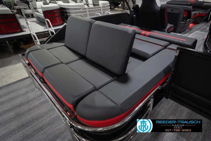Slide: The Image of 2026 Bennington 24 MSB boat interior with sleek black and red seating. - 33