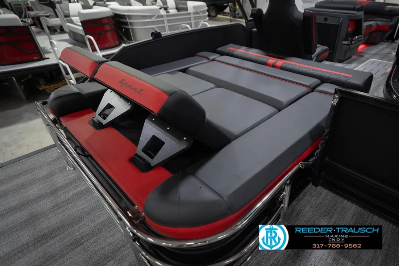 Slide: The Image of 2026 Bennington 24 MSB boat interior with luxurious black and red seating. - 34