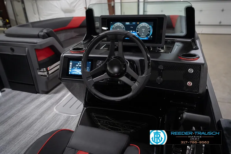 Slide: The Image of 2026 Bennington 24 MSB boat dashboard with modern steering and digital displays. - 35