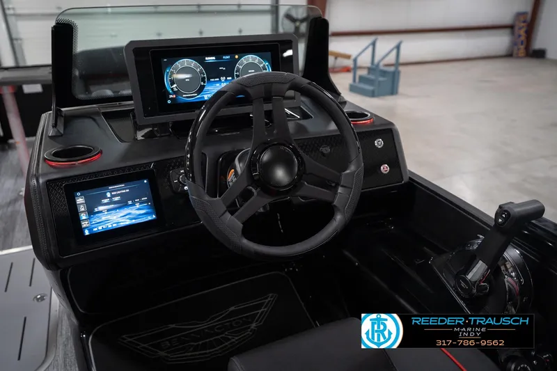 Slide: The Image of 2026 Bennington 24 MSB boat dashboard with modern steering and digital displays. - 36