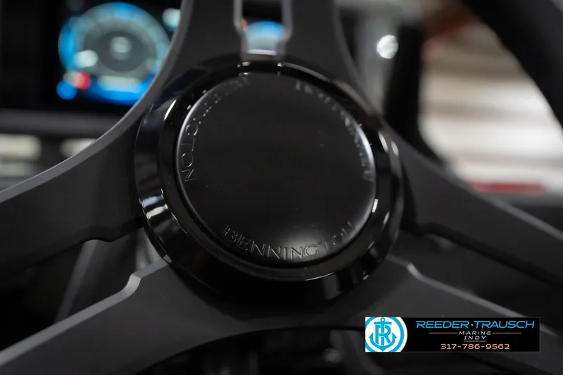 Slide: The Image of Steering wheel of 2026 Bennington 24 MSB boat, featuring Reeder-Trausch Marine logo. - 37
