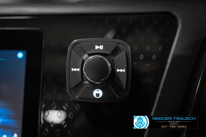 Slide: The Image of Control panel of 2026 Bennington 24 MSB boat with volume and playback buttons. - 39
