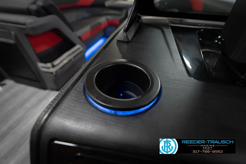 Slide: The Image of 2026 Bennington 24 MSB boat interior with illuminated cup holder and sleek design. - 49