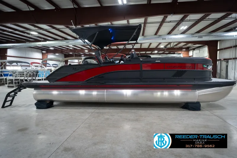 Slide: The Image of 2026 Bennington 24 MSB pontoon boat in showroom, side view. - 5