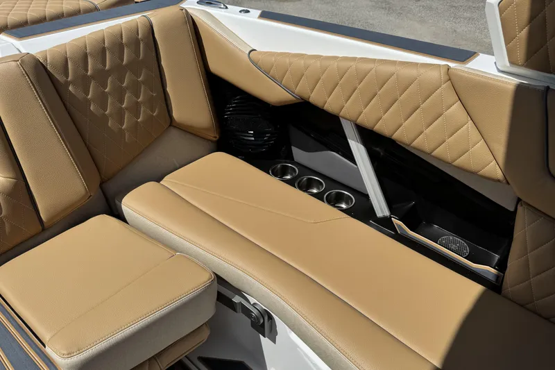 Slide: The Image of 2026 Tigé Z3 boat interior with tan quilted seats and cup holders. - 12