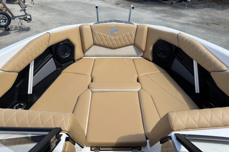 Slide: The Image of 2026 Tigé Z3 boat interior with tan quilted seating and built-in speakers. - 14