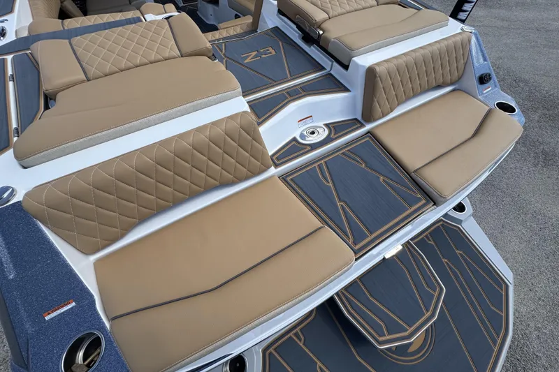 Slide: The Image of 2026 Tigé Z3 boat interior with tan quilted seats and sleek design. - 16