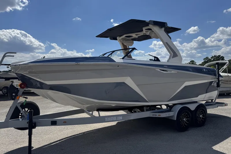 Slide: The Image of 2026 Tigé Z3 boat on trailer under blue sky with clouds. - 5