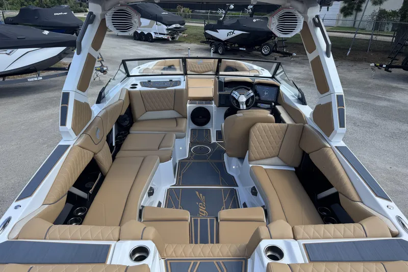 Slide: The Image of 2026 Tigé Z3 boat interior with tan leather seating and modern dashboard. - 7
