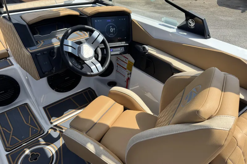 Slide: The Image of 2026 Tigé Z3 boat interior with tan leather seats and modern dashboard. - 8
