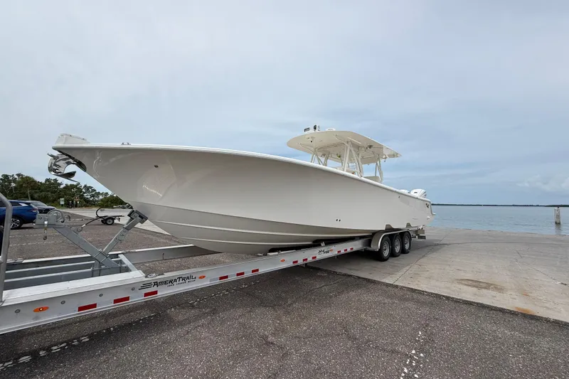The Image of 2024 SeaVee 390Z boat on trailer at dockside, ready for launch. - 0
