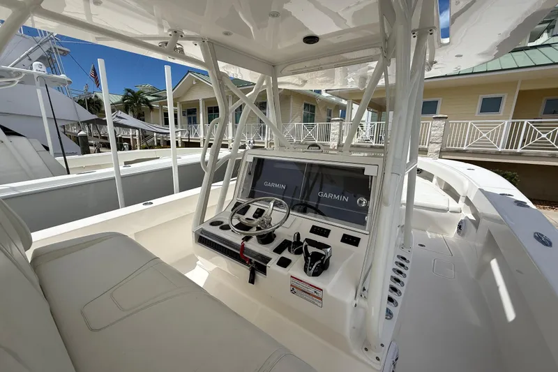 Slide: The Image of 2024 SeaVee 390Z boat cockpit with Garmin navigation system, sleek design, and modern controls. - 11