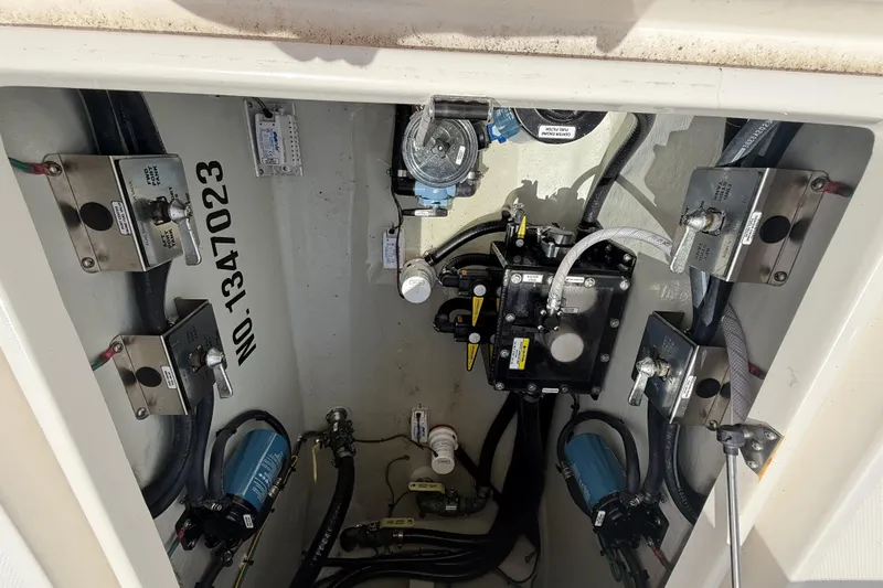 Slide: The Image of 2024 SeaVee 390Z boat compartment showcasing mechanical components and wiring. - 13