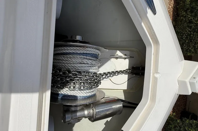 Slide: The Image of Anchor storage compartment of 2024 SeaVee 390Z boat with chain and rope. - 16