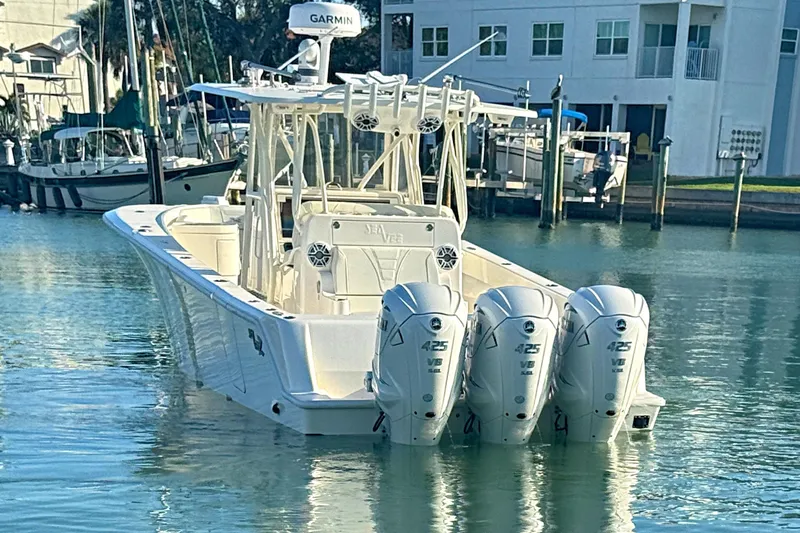 Slide: The Image of 2024 SeaVee 390Z boat with triple 425 V8 engines docked in marina. - 17
