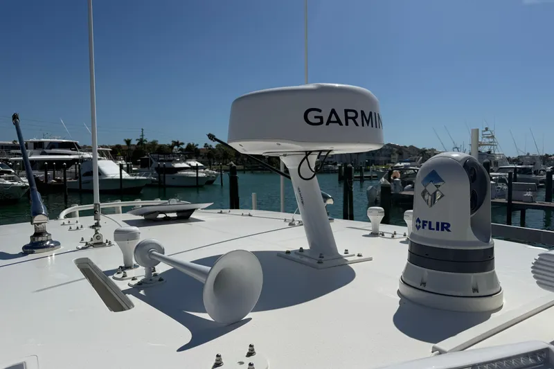Slide: The Image of 2024 SeaVee 390Z boat with Garmin and FLIR equipment at marina. - 20